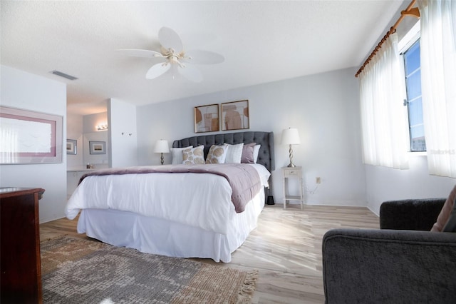 bedroom with light wood-type flooring and ceiling fan