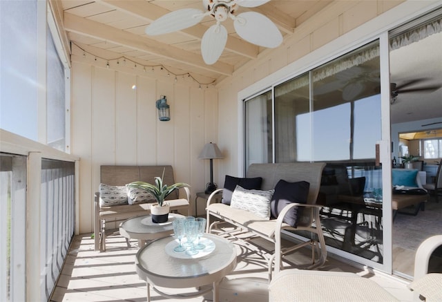 exterior space featuring beam ceiling and ceiling fan