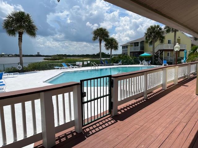 view of swimming pool featuring a patio area and a wooden deck