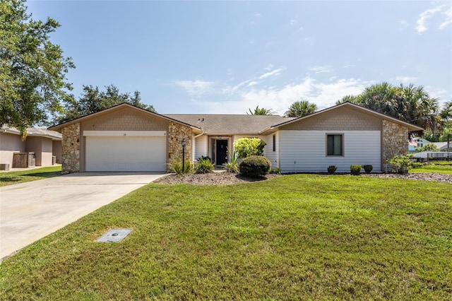 ranch-style house featuring a front lawn and a garage