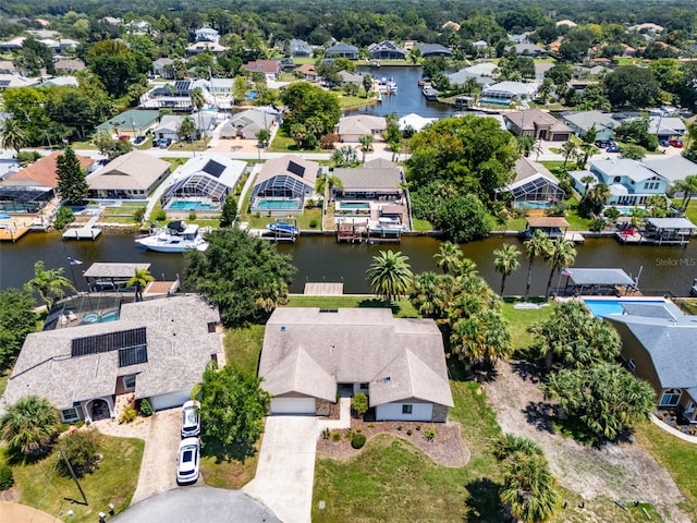 drone / aerial view with a water view and a residential view