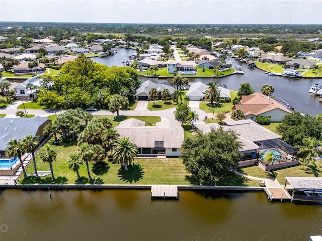 bird's eye view featuring a water view and a residential view