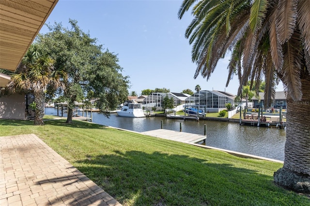 exterior space featuring a boat dock, a water view, and a residential view