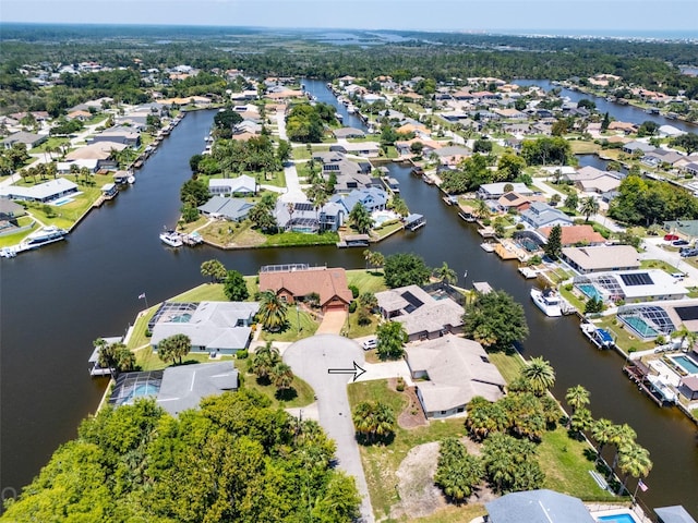 bird's eye view with a water view and a residential view