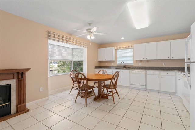 interior space with white cabinets, light tile patterned flooring, white dishwasher, and ceiling fan