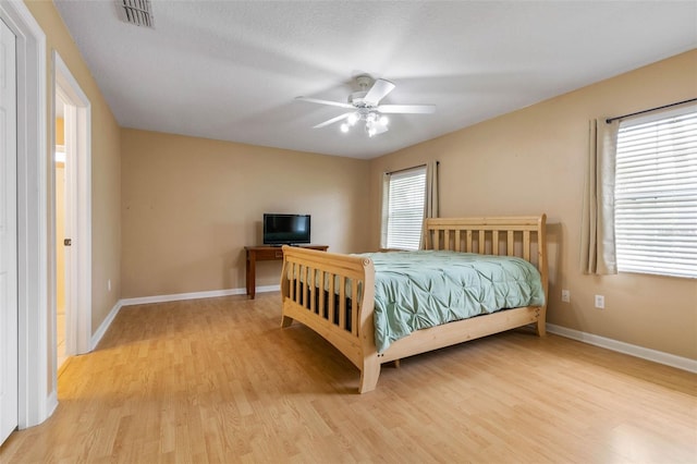 bedroom featuring ceiling fan and light hardwood / wood-style floors