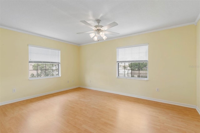 unfurnished room featuring light hardwood / wood-style flooring, ornamental molding, and ceiling fan