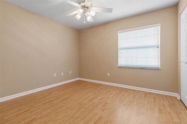 spare room with ceiling fan and light hardwood / wood-style floors