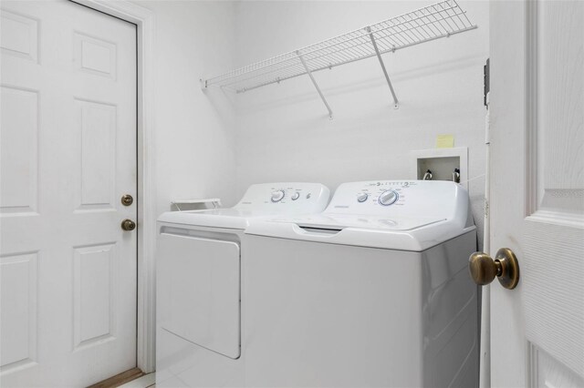 laundry room featuring washing machine and dryer