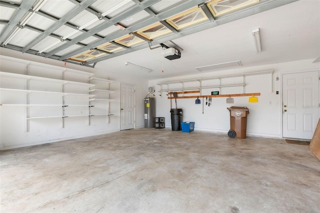 garage with a garage door opener and water heater