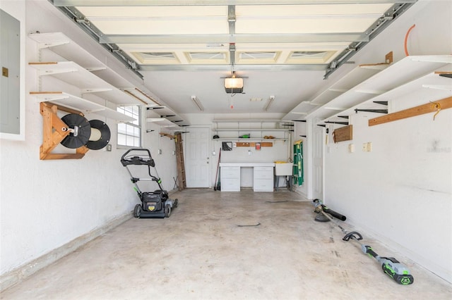 garage with a garage door opener and sink