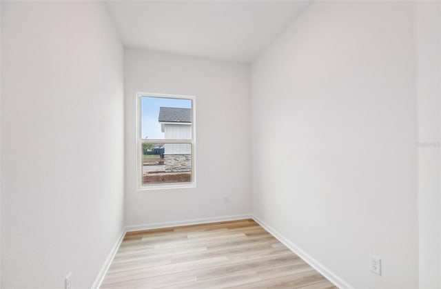 unfurnished room with light hardwood / wood-style flooring