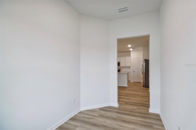 corridor featuring light wood-type flooring