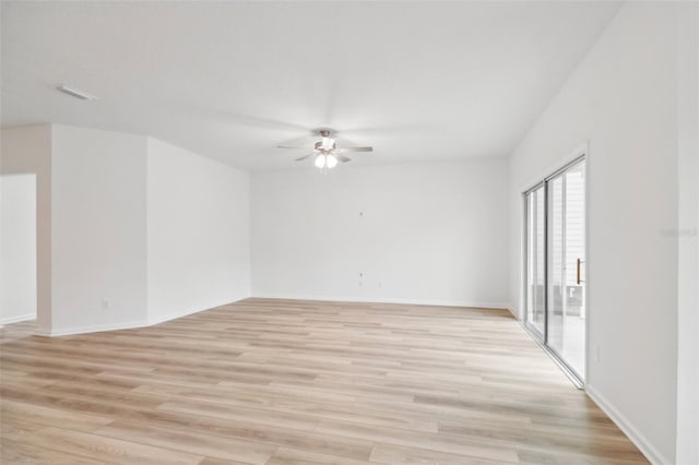 spare room with ceiling fan and light hardwood / wood-style flooring