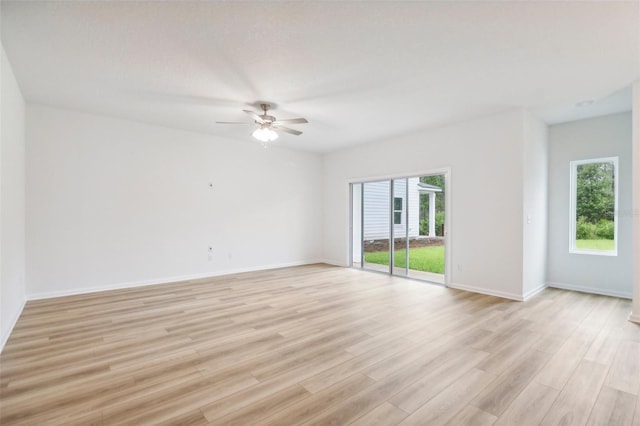 unfurnished room featuring ceiling fan and light hardwood / wood-style flooring