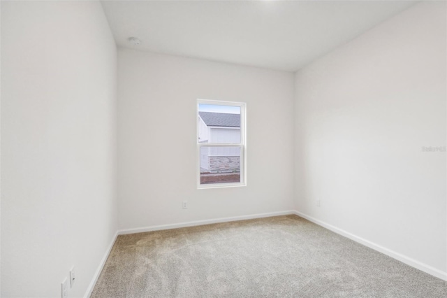 empty room with light colored carpet