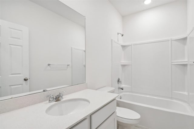 full bathroom featuring vanity,  shower combination, and toilet