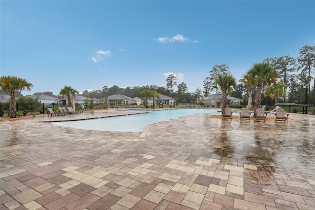 view of swimming pool with a patio area