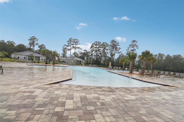 view of pool featuring a patio