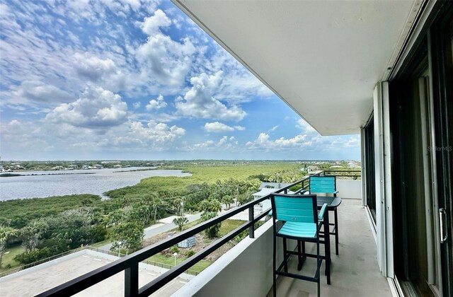 balcony featuring a water view