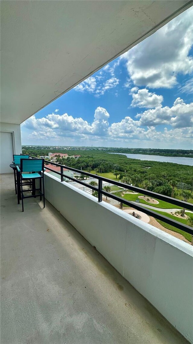 balcony featuring a water view