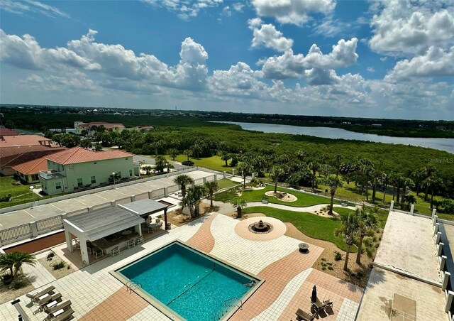 exterior space with a water view and a patio area