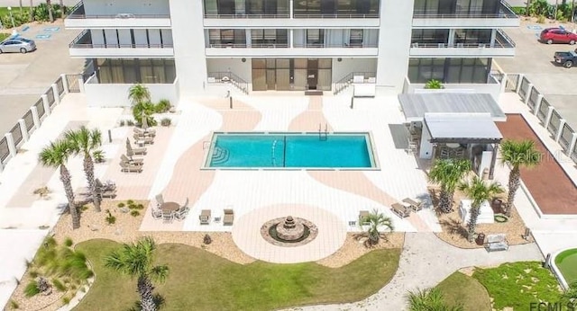 view of swimming pool featuring a patio area