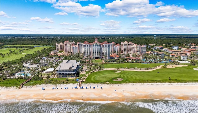 drone / aerial view with a water view and a view of the beach