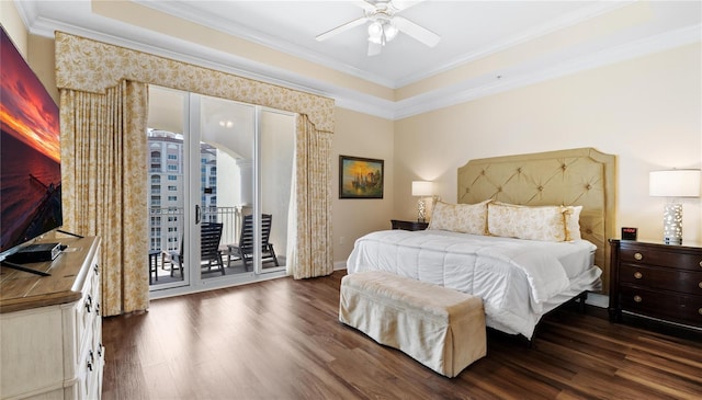 bedroom featuring ornamental molding, a raised ceiling, access to outside, wood-type flooring, and ceiling fan