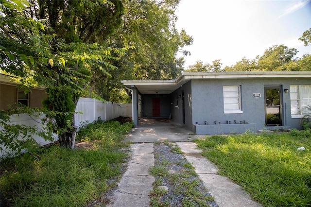 view of front of home with a carport