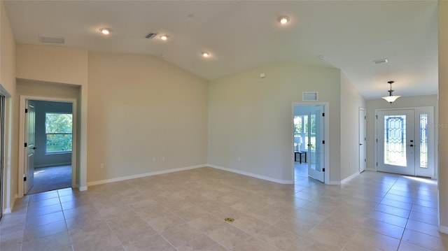 interior space with lofted ceiling and a wealth of natural light