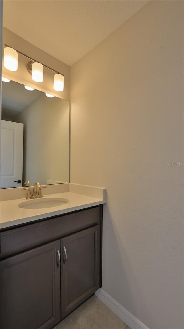 bathroom with vanity and tile patterned flooring