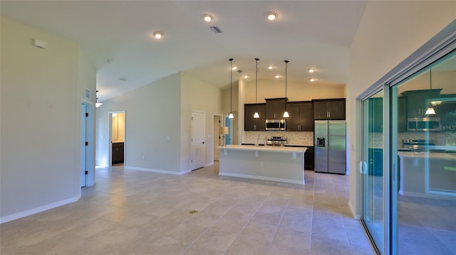 kitchen featuring pendant lighting, high vaulted ceiling, an island with sink, backsplash, and stainless steel appliances