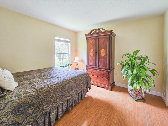 bedroom featuring hardwood / wood-style flooring