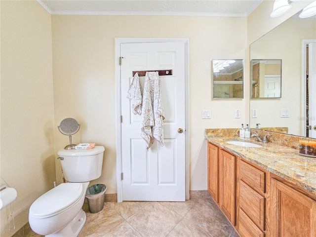 bathroom with crown molding, vanity, and toilet