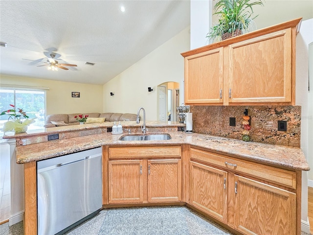 kitchen with sink, ceiling fan, tasteful backsplash, stainless steel dishwasher, and kitchen peninsula