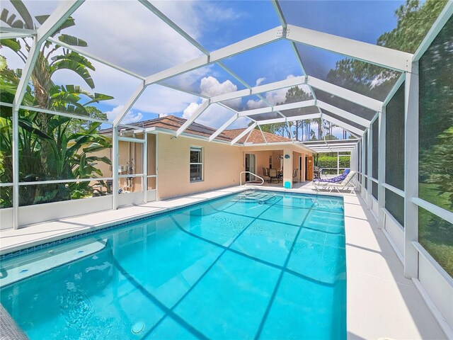 view of pool featuring a lanai and a patio area