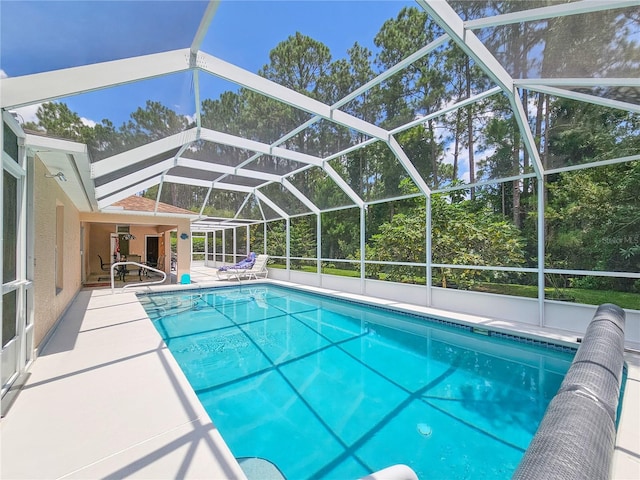 view of pool featuring a patio area and a lanai