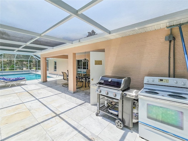 view of patio with a lanai