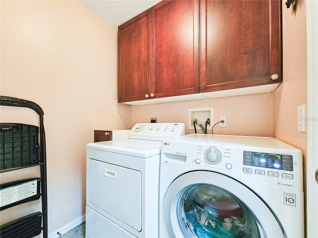 laundry area featuring cabinets and washer and dryer