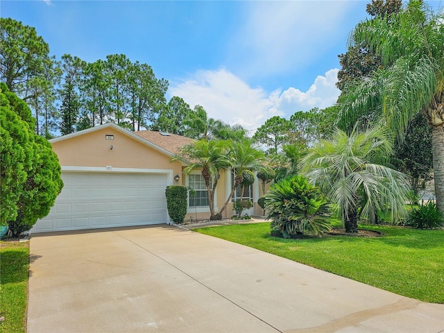 view of front of home with a garage and a front yard