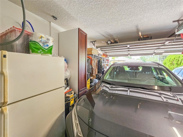 garage featuring white refrigerator