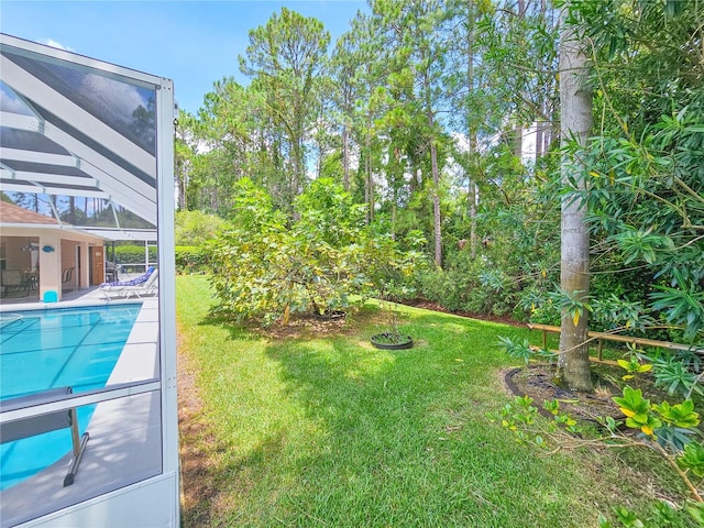 view of yard featuring a covered pool