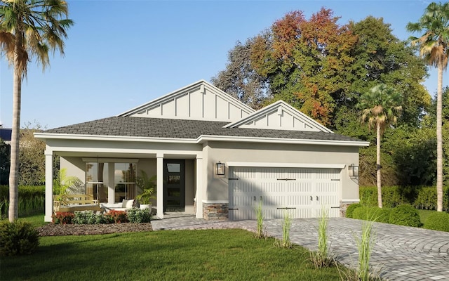 view of front facade with a front lawn and a garage