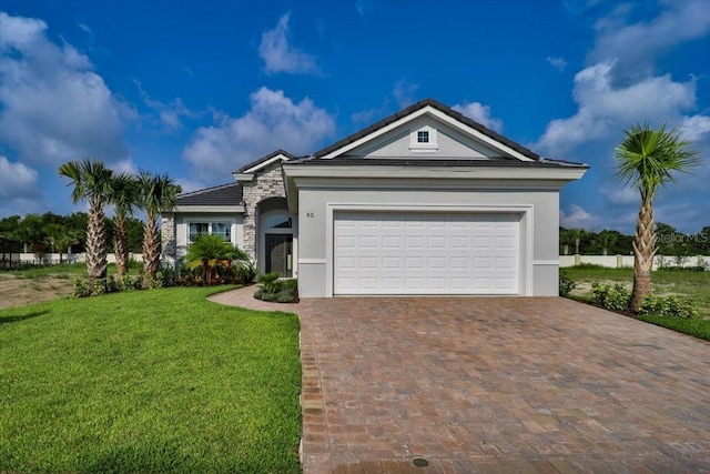 view of front of house with a front lawn and a garage