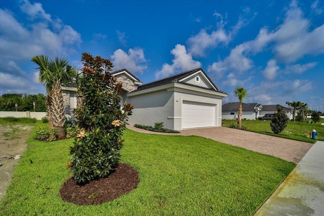 view of front of house featuring a front yard and a garage