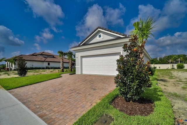 view of front facade with a front lawn and a garage