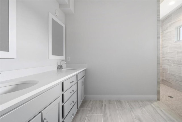 bathroom featuring double sink vanity and tile patterned flooring