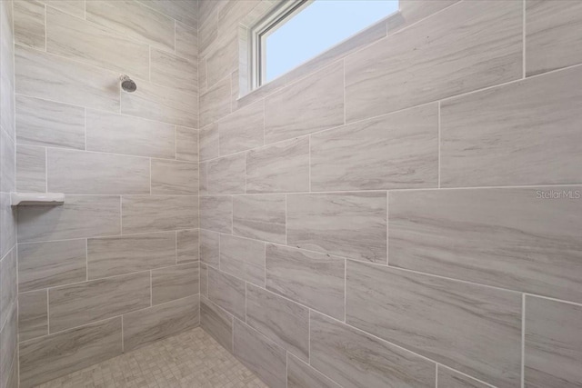 bathroom featuring a tile shower