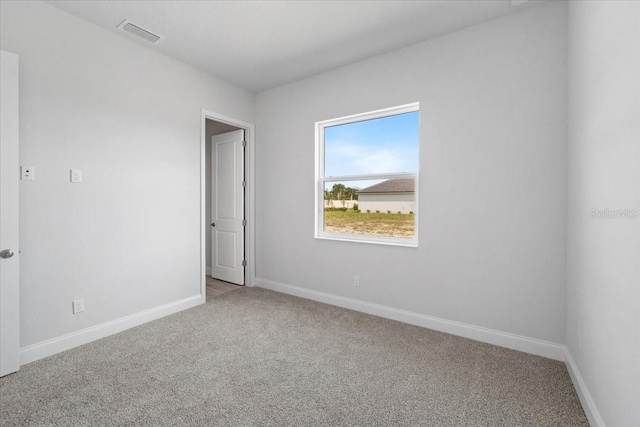 view of carpeted spare room